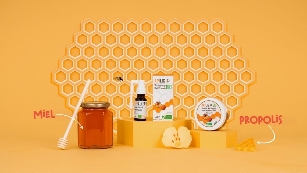Alvéoles de ruche en papier, pot de miel et produits Apilis, spot en papier découpé pour le Laboratoire ADP